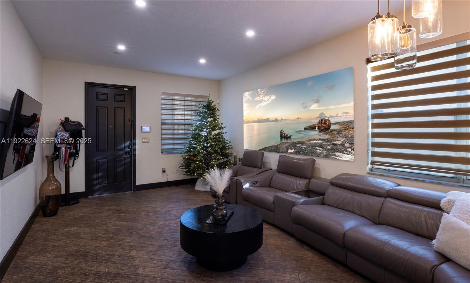 13276 Southwest 128th Street Miami, FL 33186 - Photo 4 of 27 a living room with furniture and a potted plant