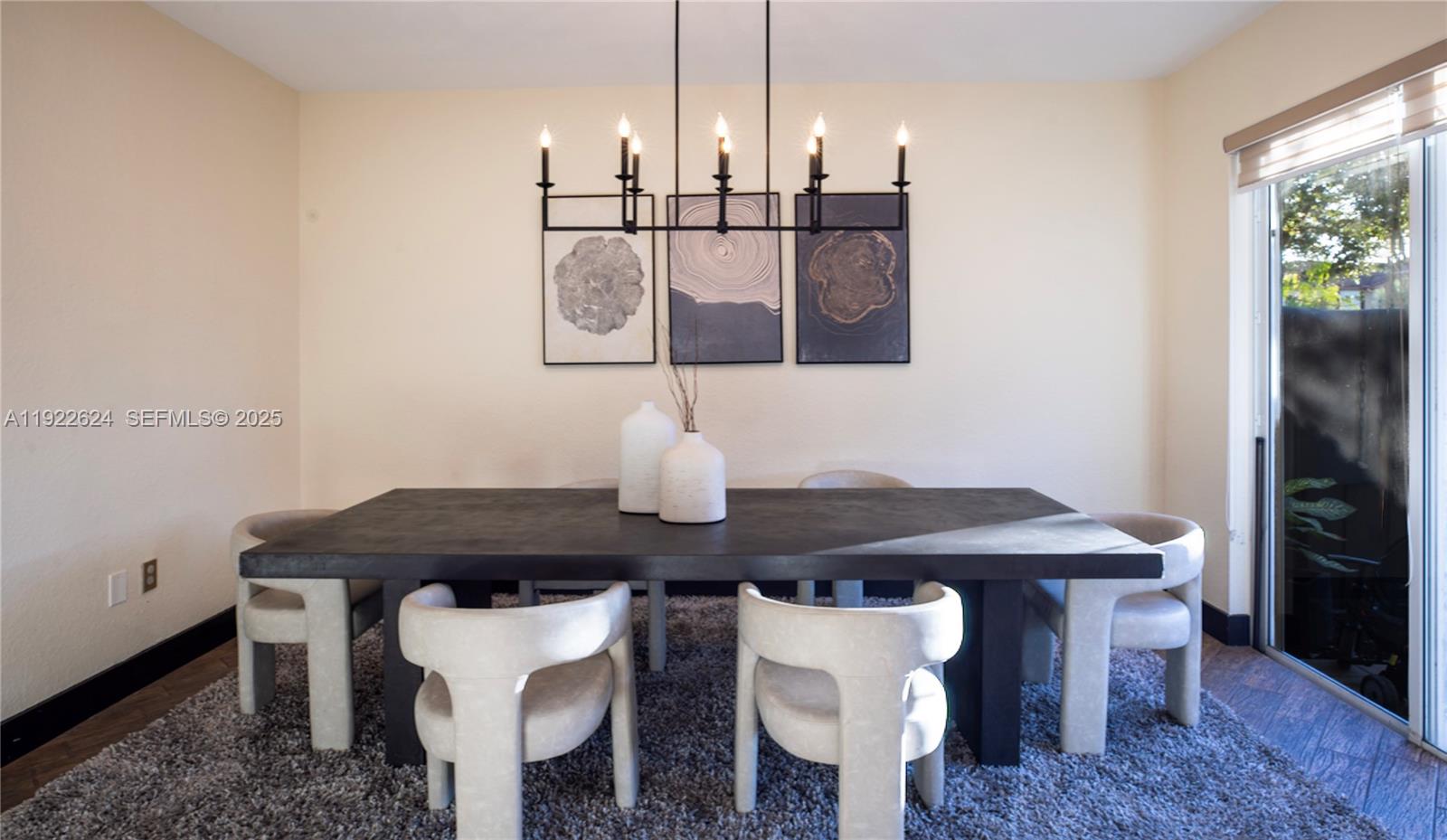 13276 Southwest 128th Street Miami, FL 33186 - Photo 9 of 27 a view of a dining room with furniture and wooden floor