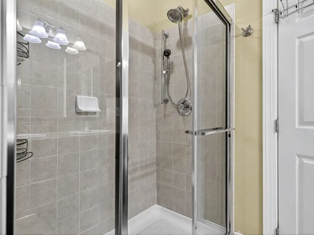 a bathroom with a glass shower door
