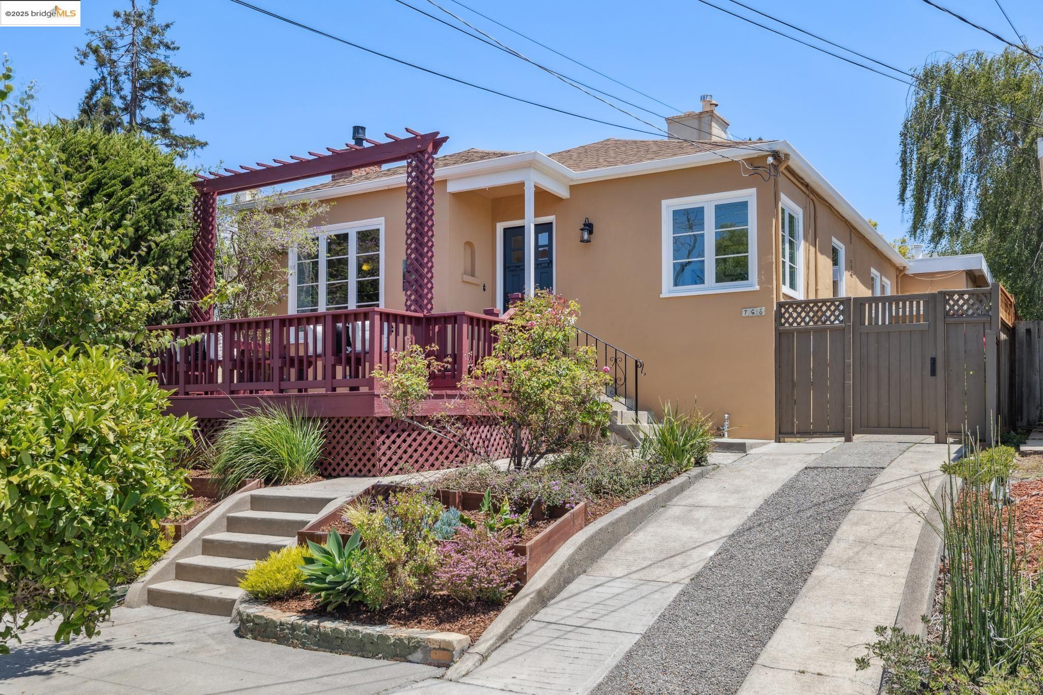 765 Neilson Street Berkeley, CA 94707 - Photo 1 of 1 a front view of a house with garden