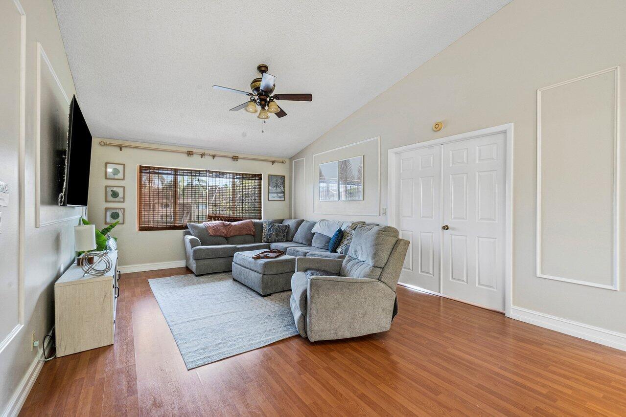 13770 Oneida Drive, Unit D2 Delray Beach, FL 33446 - Photo 3 of 34 a living room with furniture and a wooden floor