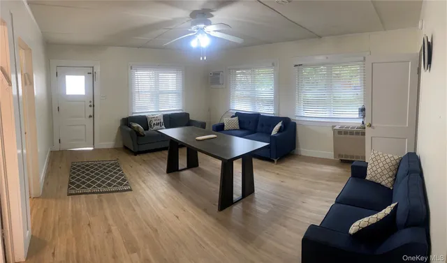 a living room with furniture and a window