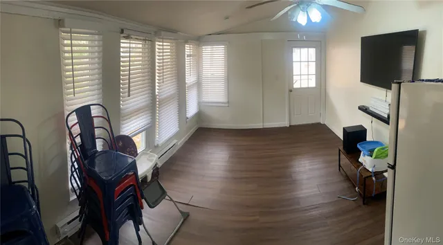 a room with furniture and a flat screen tv