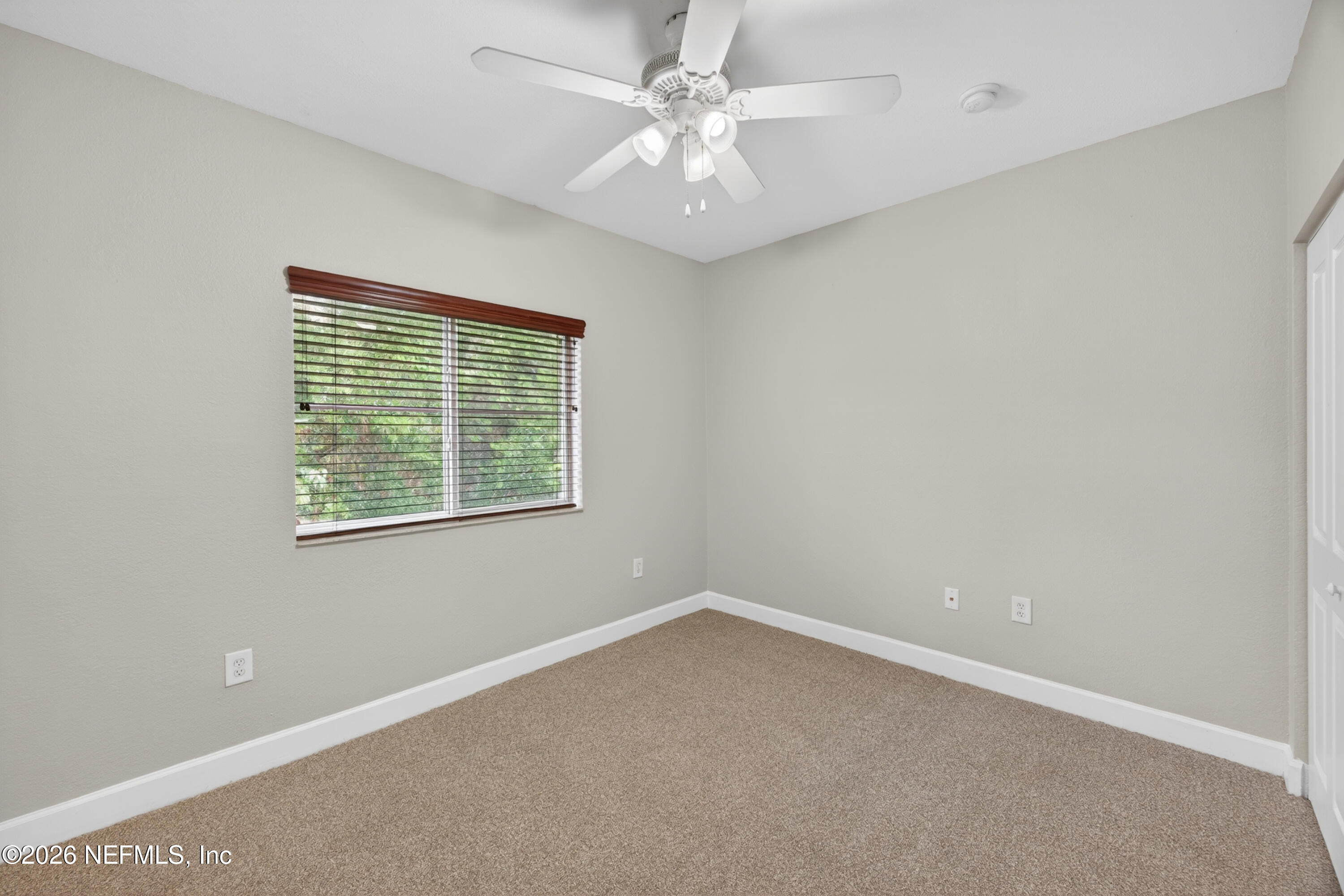 9745 Touchton Road, Unit 1224 Jacksonville, FL 32246 - Photo 16 of 22 an empty room with a window and a fan