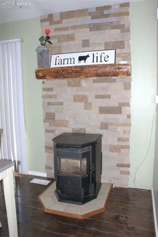 a dining room with furniture entryway and wooden floor
