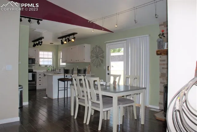 a kitchen with stainless steel appliances a stove a refrigerator and a sink