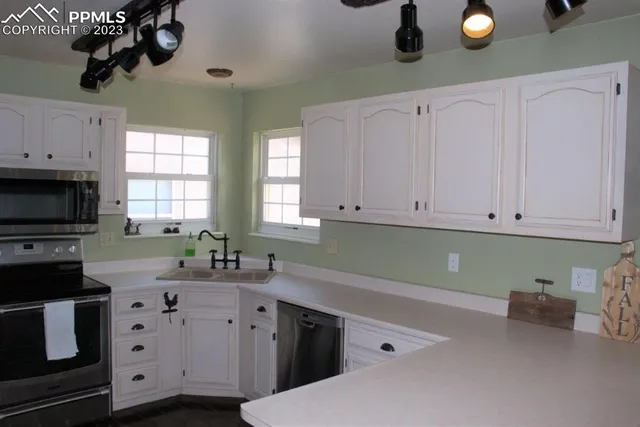 a kitchen with a sink and cabinets
