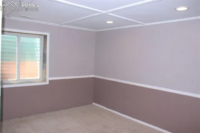 an empty room with closet and a bathroom