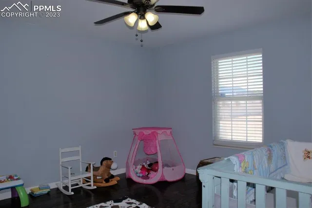 a bedroom with furniture and a window