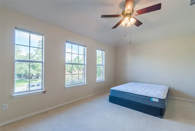 a view of a big room with carpet
