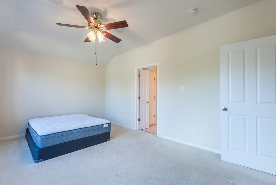 1101 Hidden View Place Round Rock, TX 78665 - Photo 23 of 37 a living room with a bed furniture and a ceiling fan