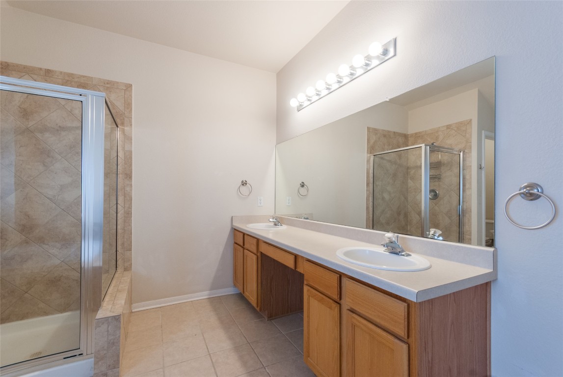 1101 Hidden View Place Round Rock, TX 78665 - Photo 29 of 37 a bathroom with a sink and a mirror