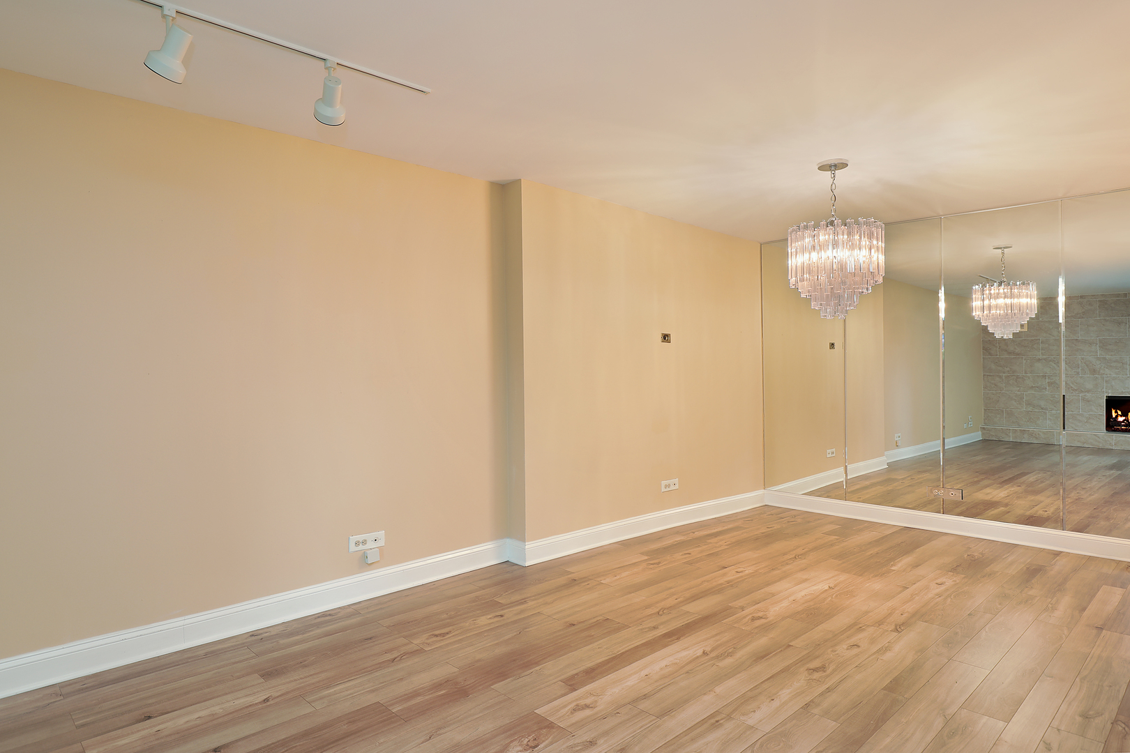 1621 Mission Hills Road, Unit 104 Northbrook, IL 60062 - Photo 24 of 29 a view of a room with wooden floor and chandelier