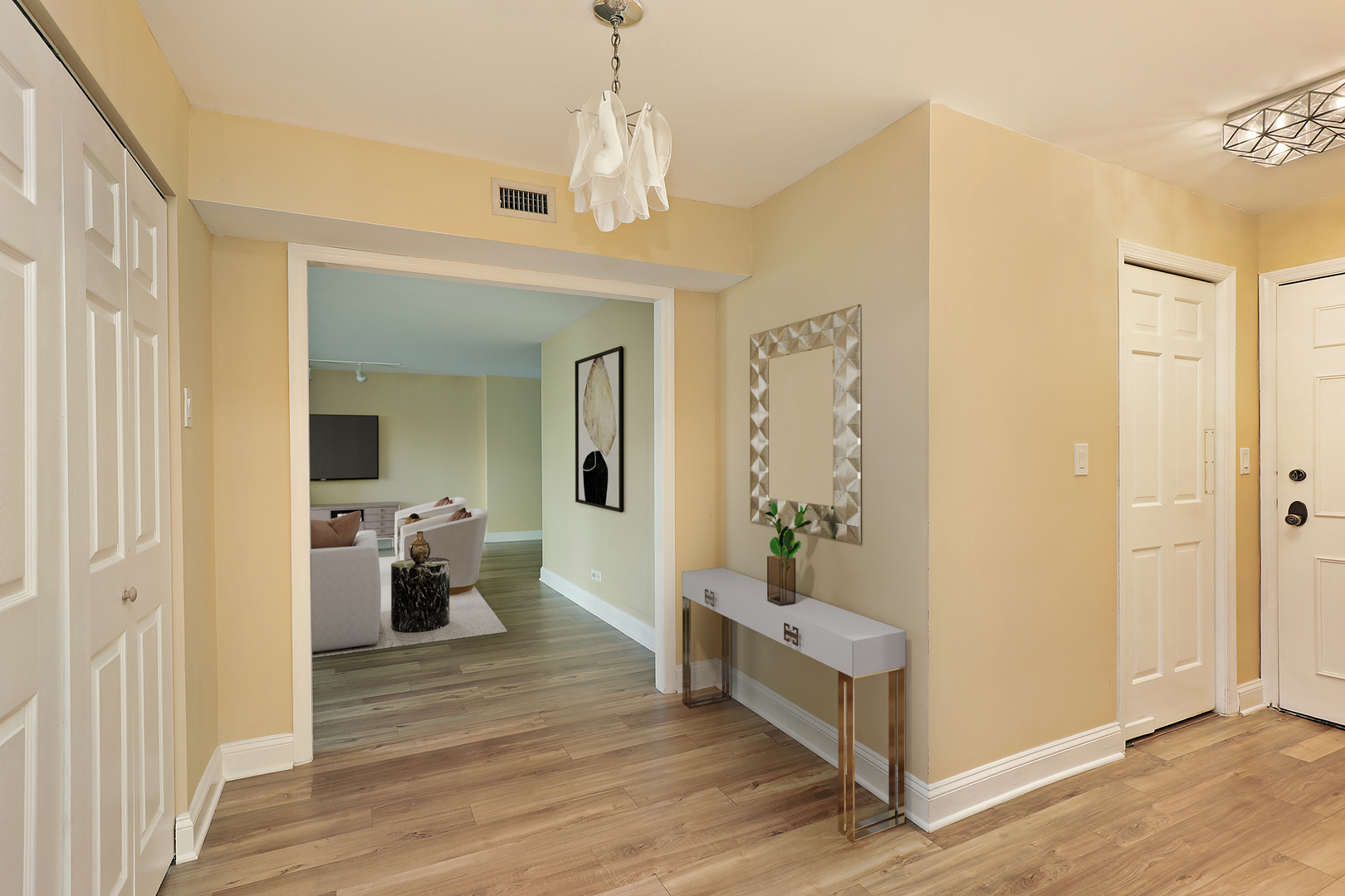 1621 Mission Hills Road, Unit 104 Northbrook, IL 60062 - Photo 5 of 29 a view of a bedroom with wooden floor and staircase