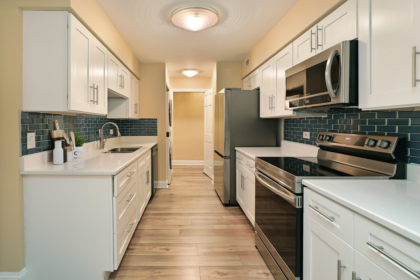 1621 Mission Hills Road, Unit 104 Northbrook, IL 60062 - Photo 10 of 29 a kitchen with stainless steel appliances a stove microwave and a sink