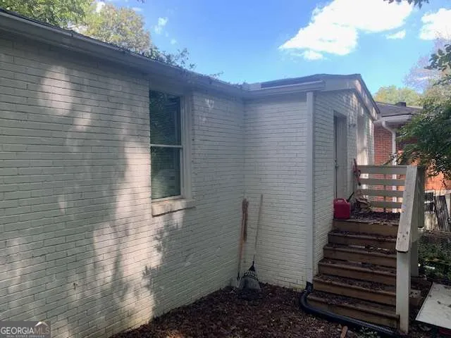a view of a backyard of the house