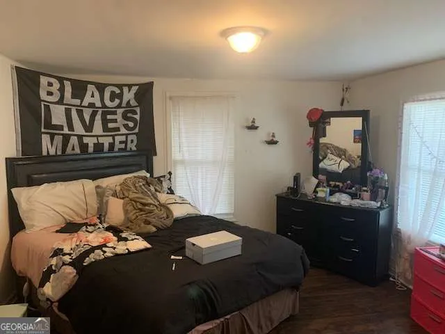 a bedroom with a bed and a dresser