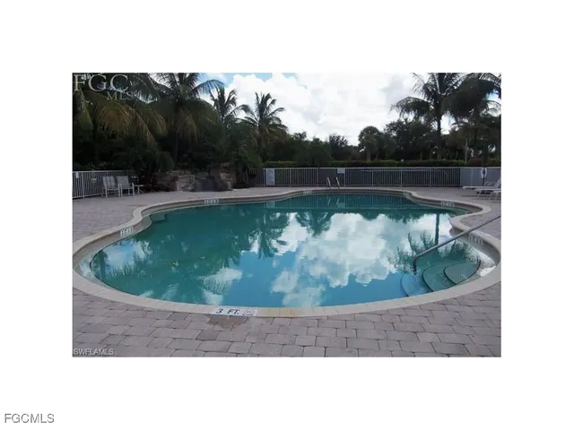 a view of swimming pool with a yard