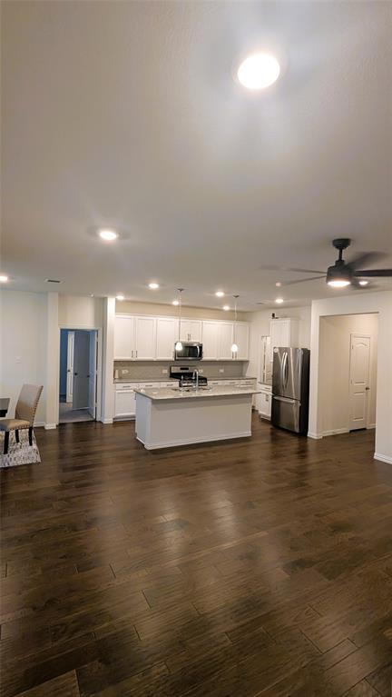 2408 Wildhaven Road Crandall, TX 75114 - Photo 14 of 39 Kitchen with recessed lighting, white cabinetry, appliances with stainless steel finishes, pendant lighting, and a ceiling fan
