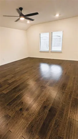 a view of room with wooden floor