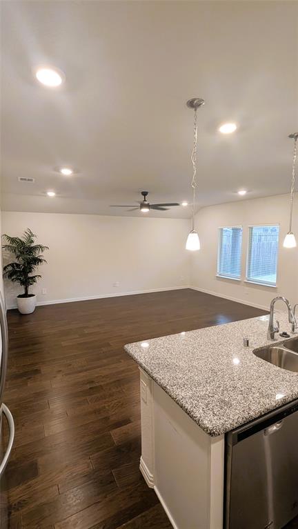 2408 Wildhaven Road Crandall, TX 75114 - Photo 39 of 39 Kitchen with open floor plan, pendant lighting, dishwasher, ceiling fan, and dark wood-style floors