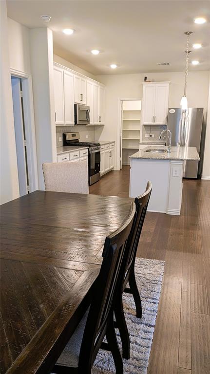 2408 Wildhaven Road Crandall, TX 75114 - Photo 24 of 39 Dining room with recessed lighting and dark wood-style floors