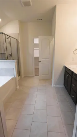 a view of a kitchen with furniture and cabinets