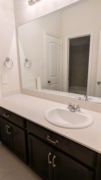 2408 Wildhaven Road Crandall, TX 75114 - Photo 6 of 39 Bathroom featuring vanity, light tile patterned floors, and a bathtub