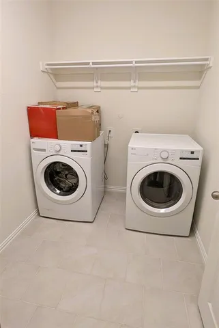 a utility room with dryer and washer