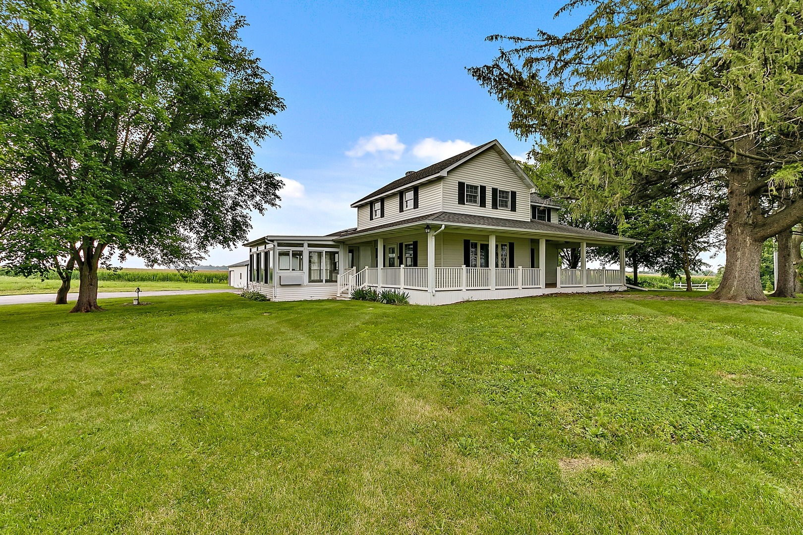1016 West Corning Road Beecher, IL 60401 - Photo 5 of 35 a front view of a house with a garden