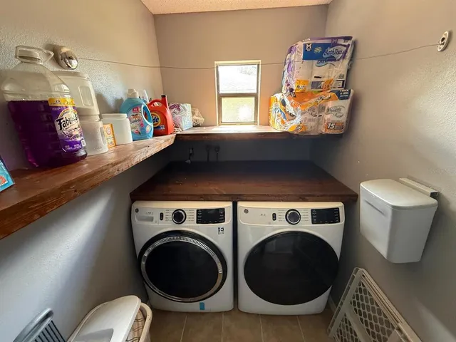 a utility room with dryer and washer