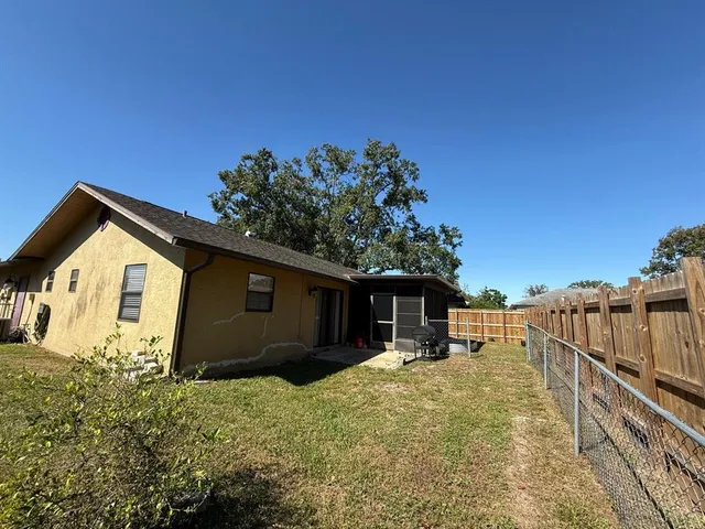 a house with trees in the background