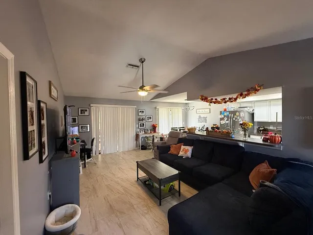 a living room with furniture and a window