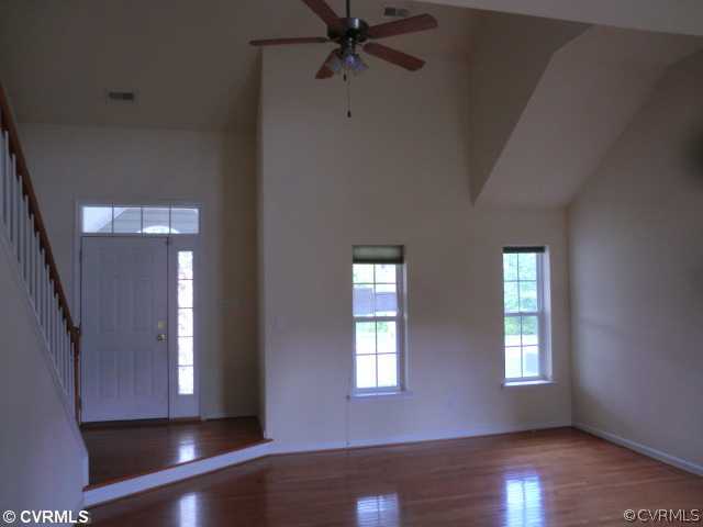 9237 Scotts Bluff Lane Chesterfield, VA 23832 - Photo 2 of 10 a view of an entryway with wooden floor and a window
