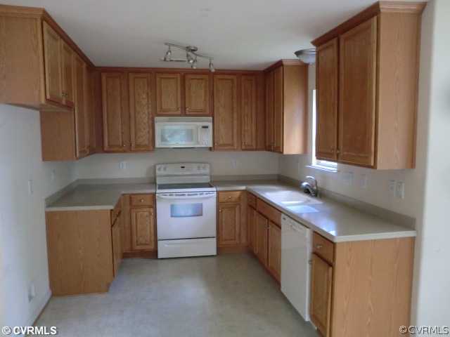 9237 Scotts Bluff Lane Chesterfield, VA 23832 - Photo 4 of 10 a kitchen with stainless steel appliances granite countertop a sink stove and cabinets