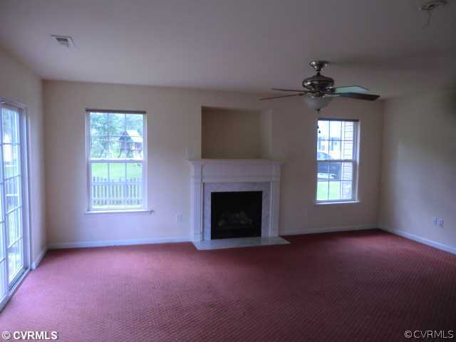 9237 Scotts Bluff Lane Chesterfield, VA 23832 - Photo 5 of 10 a view of empty room with a fireplace