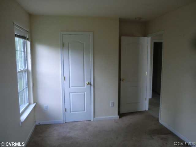 9237 Scotts Bluff Lane Chesterfield, VA 23832 - Photo 8 of 10 an empty room with windows and closet