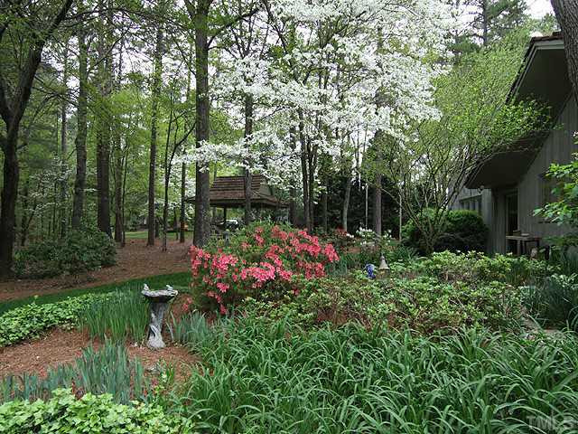 205 Beckley Court Raleigh, NC 27615 - Photo 22 of 25 The Beauty Is Abundant Throughout The Seasons With a Colorful Array of Shrubs and Perennials. Yard