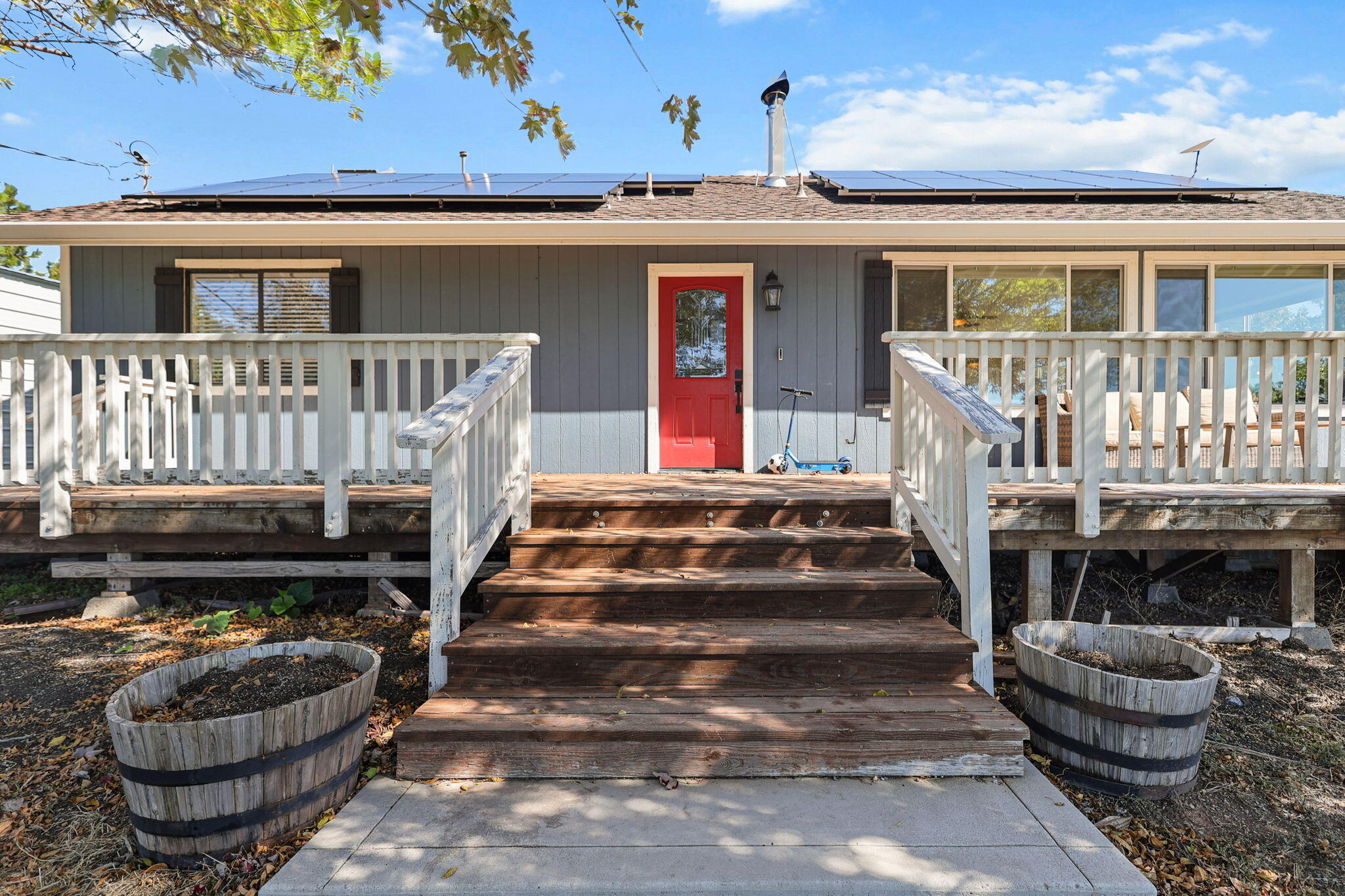29453 Round Mountain Road Bella Vista, CA 96008 - Photo 2 of 31 a view of a patio with couches chairs and a fire pit