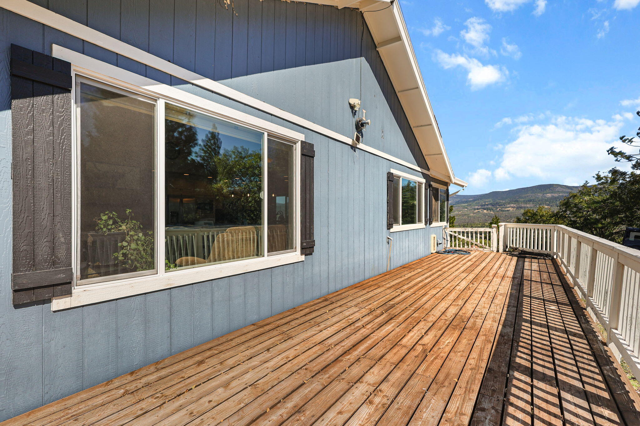 29453 Round Mountain Road Bella Vista, CA 96008 - Photo 23 of 31 a view of a house with a roof deck