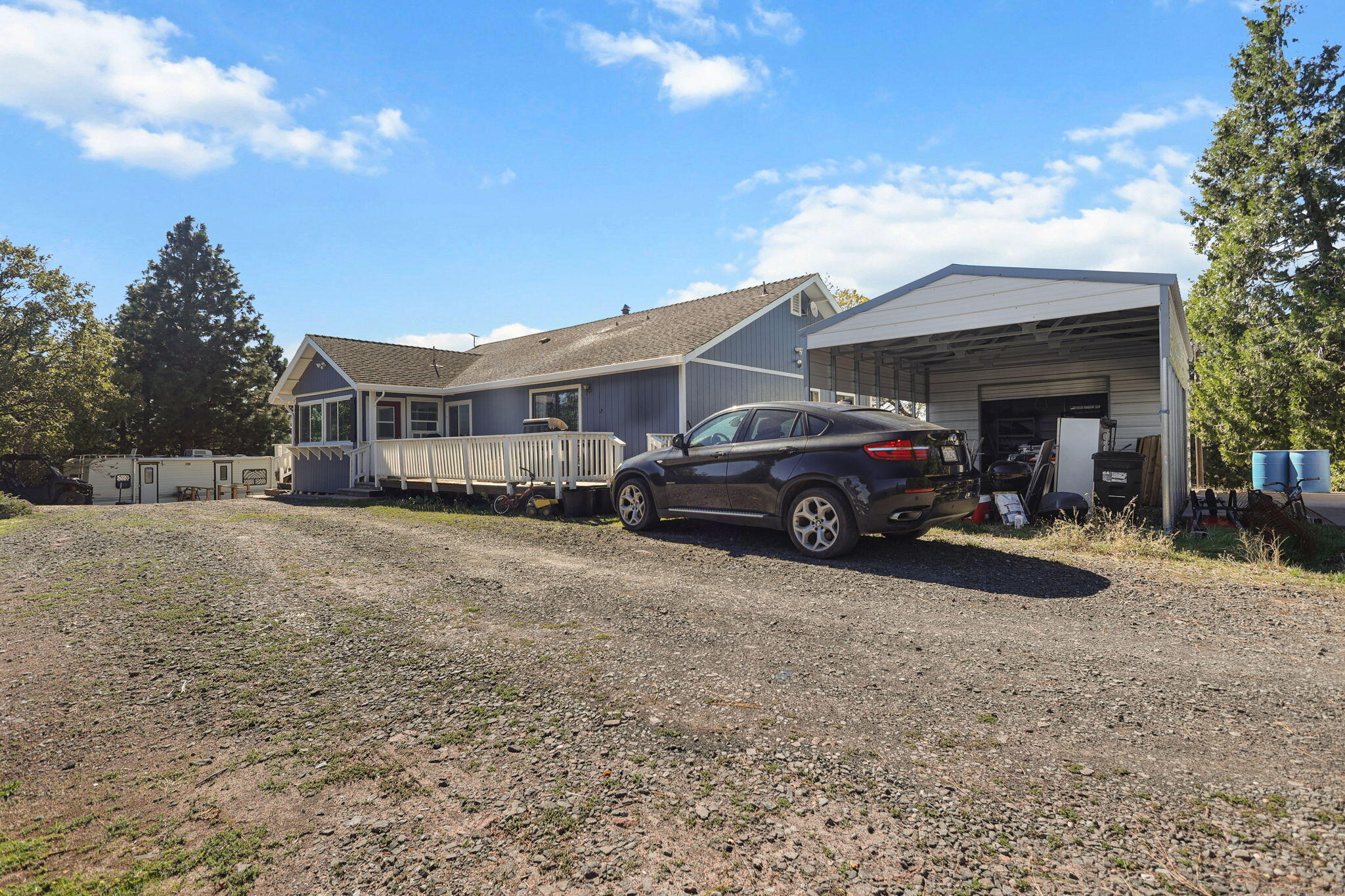 29453 Round Mountain Road Bella Vista, CA 96008 - Photo 27 of 31 a view of a car park in front of house