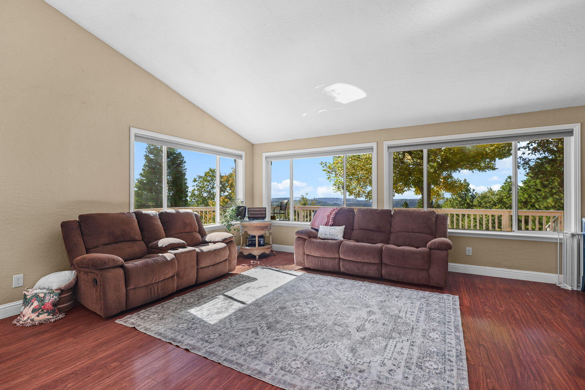 29453 Round Mountain Road Bella Vista, CA 96008 - Photo 5 of 31 a living room with furniture and a large window