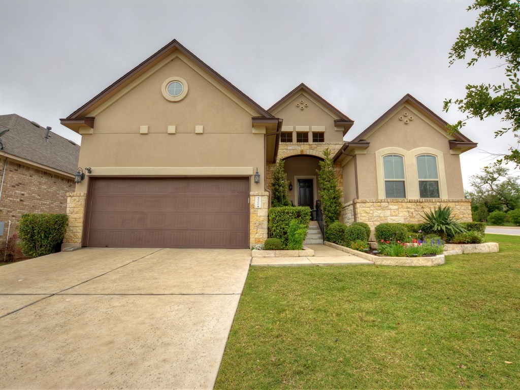 4900 Pyrenees Pass Bee Cave, TX 78738 - Photo 1 of 1 a front view of a house with a yard