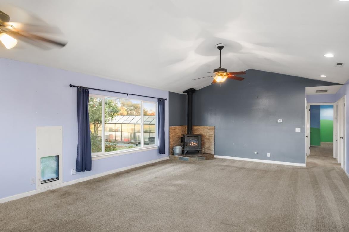 3402 Burson Road Burson, CA 95225 - Photo 13 of 65 a view of empty room with a fireplace and window