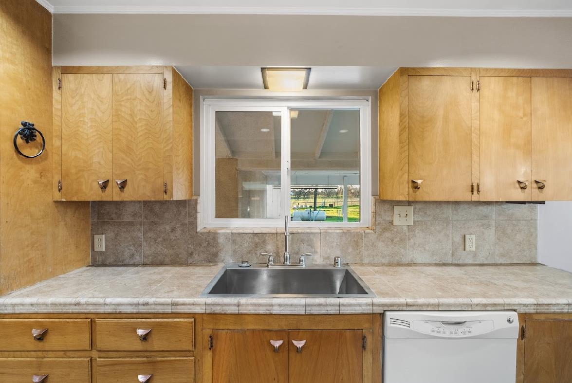 3402 Burson Road Burson, CA 95225 - Photo 17 of 65 a kitchen with granite countertop a sink and a window