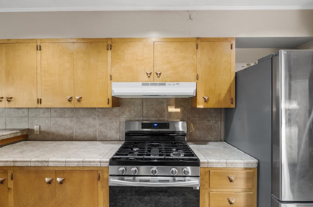 3402 Burson Road Burson, CA 95225 - Photo 18 of 65 a kitchen with a stove and a refrigerator
