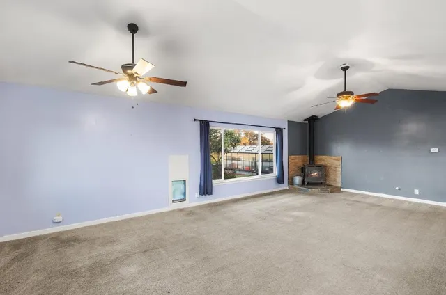 a view of a hallway with wooden floor and closet
