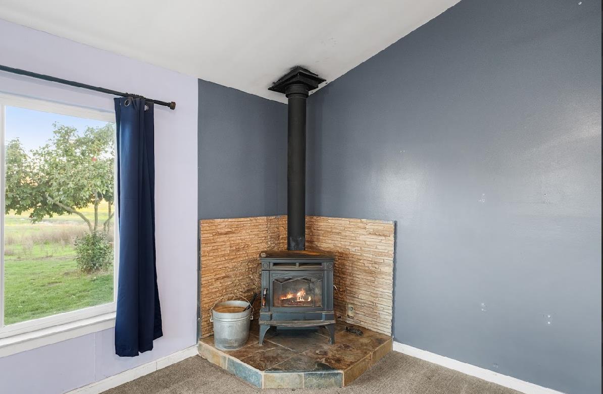 3402 Burson Road Burson, CA 95225 - Photo 22 of 65 a view of hallway with a floor to ceiling window and wooden floor