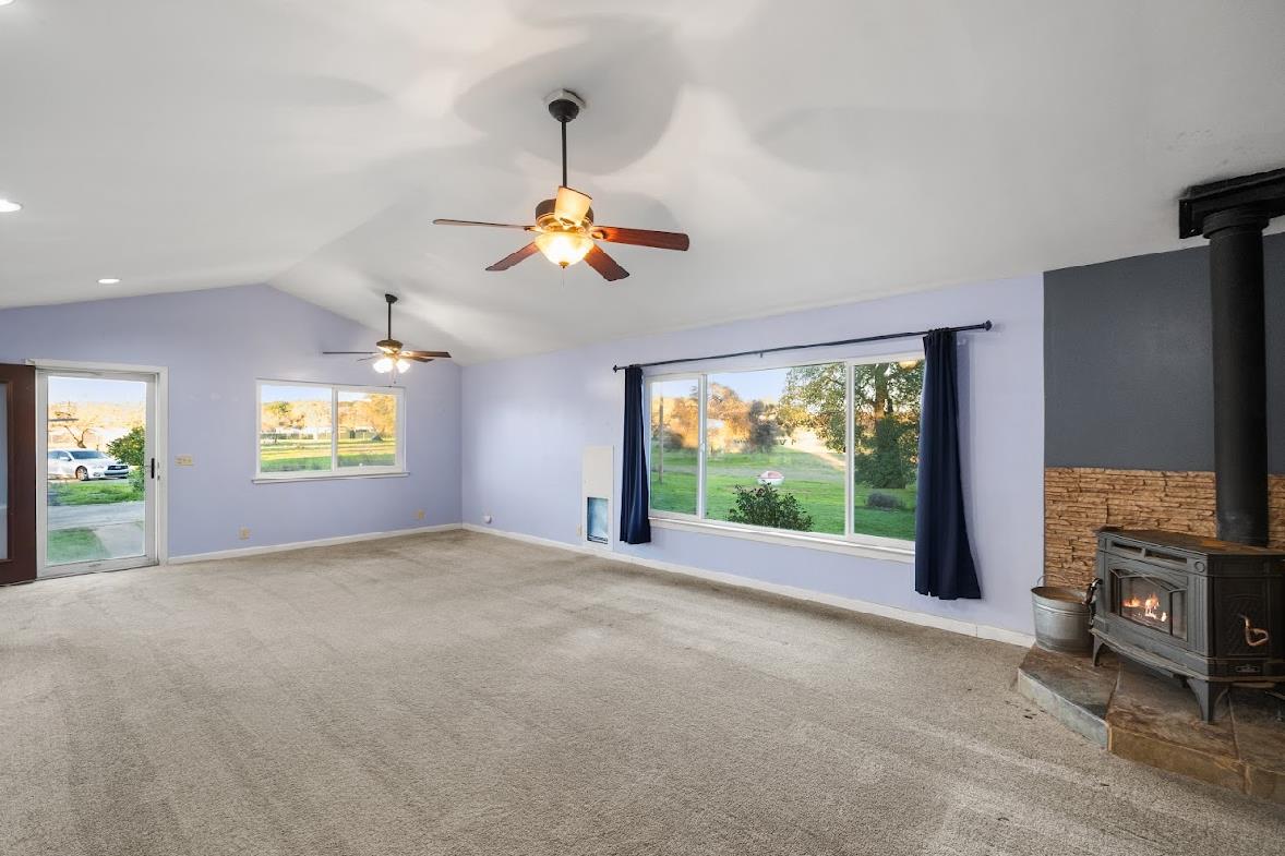 3402 Burson Road Burson, CA 95225 - Photo 23 of 65 a view of empty room with a fireplace and window