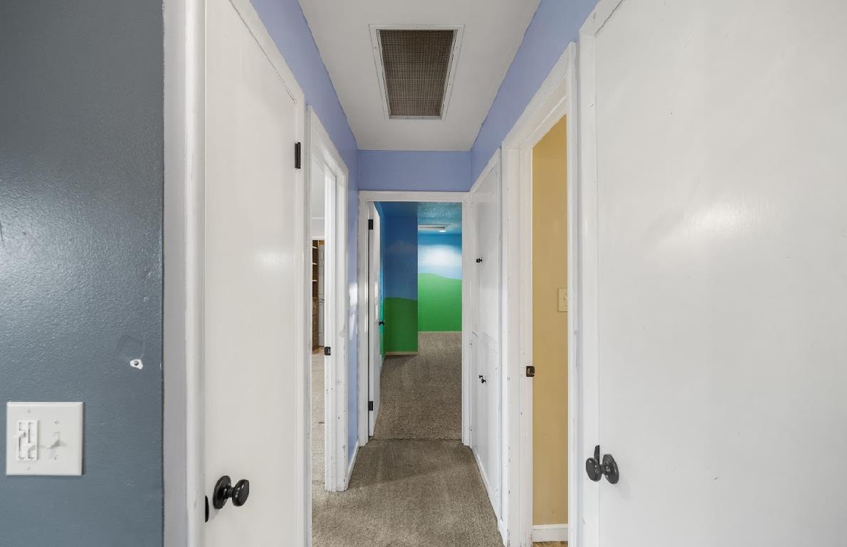 3402 Burson Road Burson, CA 95225 - Photo 24 of 65 a view of a hallway with wooden floor and closet